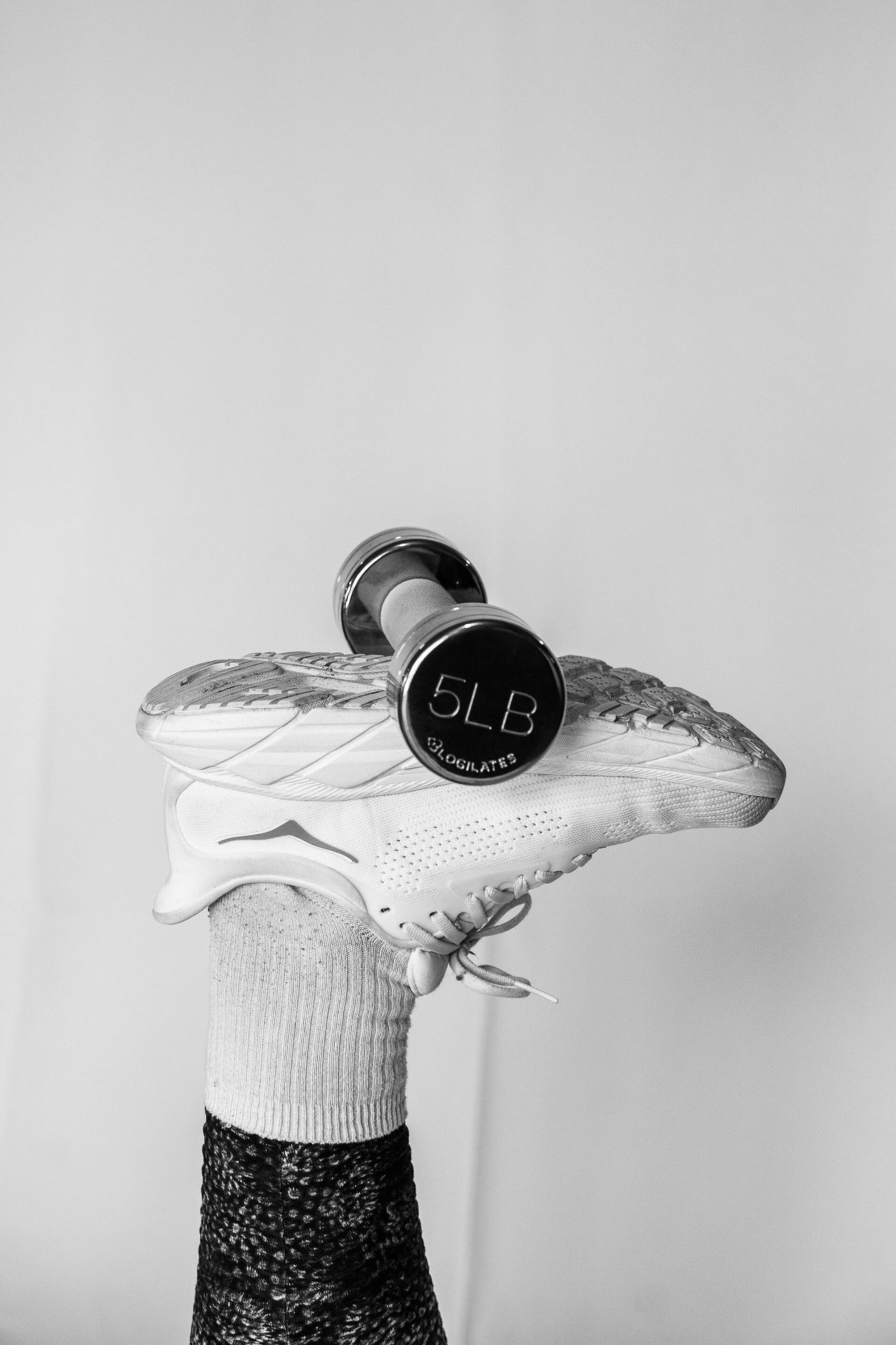 Foot holding 5lb weight